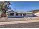 Charming single-story home featuring a well-maintained yard and attached two-car garage at 1718 W Voltaire Ave, Phoenix, AZ 85029
