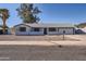 Single-story home with desert landscaping, neutral color palette, and an attached garage at 1718 W Voltaire Ave, Phoenix, AZ 85029