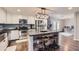 Bright kitchen featuring stainless steel appliances, white cabinets, and a center island with barstool seating at 1718 W Voltaire Ave, Phoenix, AZ 85029