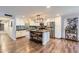 Modern kitchen with white cabinetry, stainless steel appliances, and a rustic island at 1718 W Voltaire Ave, Phoenix, AZ 85029