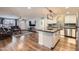 Open-concept living space seamlessly connecting kitchen, living, and dining areas at 1718 W Voltaire Ave, Phoenix, AZ 85029