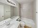Clean bathroom featuring a single sink vanity, a large mirror, and a shower-tub combo at 1739 E Carter Rd, Phoenix, AZ 85042