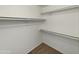 Walk-in closet with fresh paint, carpeted floors, and shelving at 1739 E Carter Rd, Phoenix, AZ 85042