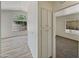 Hallway with fresh paint, modern flooring, and neutral colors at 1739 E Carter Rd, Phoenix, AZ 85042