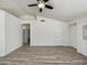 Open living area featuring wood-look flooring, a ceiling fan, and access to the front door at 1739 E Carter Rd, Phoenix, AZ 85042
