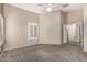 Comfortable bedroom features neutral walls, modern ceiling fan and plantation shutters at 19576 N Portarosa Ct, Maricopa, AZ 85138