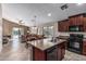 Open-concept kitchen seamlessly flowing into the dining and living areas, great for entertaining at 19576 N Portarosa Ct, Maricopa, AZ 85138