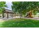 Community park with picnic tables, a playground, and lush green spaces at 19576 N Portarosa Ct, Maricopa, AZ 85138