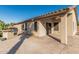 Covered patio with stained concrete, outdoor kitchen and direct access to the house at 19576 N Portarosa Ct, Maricopa, AZ 85138