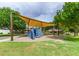 Playground with climbing wall and shade structure offers fun activities for residents of all ages at 19576 N Portarosa Ct, Maricopa, AZ 85138