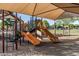 Well-maintained playground with slides and play structures, offering a fun and safe environment for children at 19576 N Portarosa Ct, Maricopa, AZ 85138