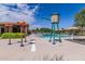 Inviting community pool with water features, providing a refreshing and enjoyable space for residents at 19576 N Portarosa Ct, Maricopa, AZ 85138