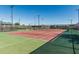 Well-maintained tennis courts for recreational play, featuring new nets and fencing in a great community at 19576 N Portarosa Ct, Maricopa, AZ 85138