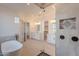 This spacious bathroom boasts double vanities, a soaking tub, and a walk-in shower at 2005 W Lincoln Ct, Queen Creek, AZ 85144