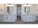 Double vanities in a bathroom with undermount sinks and matching black fixtures at 2005 W Lincoln Ct, Queen Creek, AZ 85144