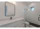 Bright bathroom with a modern vanity, sink, and a glass-enclosed shower at 2005 W Lincoln Ct, Queen Creek, AZ 85144