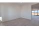 Bright bedroom with light tile flooring and a view of the sliding glass doors at 2005 W Lincoln Ct, Queen Creek, AZ 85144