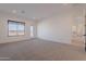 This bedroom offers natural light and neutral carpet at 2005 W Lincoln Ct, Queen Creek, AZ 85144
