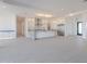 Open-concept living features a large kitchen with an island and stainless appliances at 2005 W Lincoln Ct, Queen Creek, AZ 85144