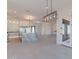 Open kitchen with an island, pendant lighting, and stainless steel appliances at 2005 W Lincoln Ct, Queen Creek, AZ 85144