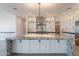 Bright kitchen featuring a large island, stainless steel appliances, and modern pendant lighting above the granite island at 2005 W Lincoln Ct, Queen Creek, AZ 85144