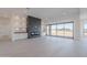 Bright living room with a modern fireplace and large windows at 2005 W Lincoln Ct, Queen Creek, AZ 85144