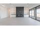 Spacious living room with fireplace and sliding doors to the outdoors at 2005 W Lincoln Ct, Queen Creek, AZ 85144