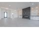 Open-concept living space with fireplace, built-ins, and designer lighting at 2005 W Lincoln Ct, Queen Creek, AZ 85144