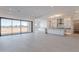 A spacious living room showcases an open floor plan, light tile, and sliding glass doors to the outdoor space at 2005 W Lincoln Ct, Queen Creek, AZ 85144