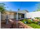 Inviting backyard with outdoor space, privacy fence, water feature, and lovely plants at 201 S Greenfield Rd # 29, Mesa, AZ 85206