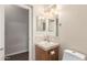 Cozy bathroom with single vanity, neutral paint, and updated fixtures at 201 S Greenfield Rd # 29, Mesa, AZ 85206