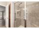Accessible bathroom features a tiled shower with grab bars and built in cabinet space at 201 S Greenfield Rd # 29, Mesa, AZ 85206