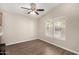 Cozy bedroom featuring a ceiling fan, natural light, and modern wood-look flooring at 201 S Greenfield Rd # 29, Mesa, AZ 85206