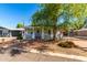 Well-maintained home exterior featuring a covered porch, brick walkway, and inviting curb appeal at 201 S Greenfield Rd # 29, Mesa, AZ 85206