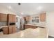 Well-lit kitchen with stainless steel appliances, wooden cabinets, and countertop space at 201 S Greenfield Rd # 29, Mesa, AZ 85206