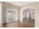 Open-concept living space with wood-look flooring, neutral paint, and access to the backyard at 201 S Greenfield Rd # 29, Mesa, AZ 85206