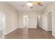 Bright main bedroom featuring wood-look flooring, a ceiling fan, and neutral wall color at 201 S Greenfield Rd # 29, Mesa, AZ 85206
