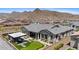 Stunning backyard with a putting green, covered patio, outdoor seating, and lush landscaping at 20795 W San Juan Ave, Buckeye, AZ 85396