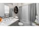 Bathroom featuring modern vanity with a marble countertop, updated lighting, and a shower-tub combo at 20795 W San Juan Ave, Buckeye, AZ 85396