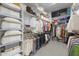 Walk-in closet with custom shelving and ample storage space at 20795 W San Juan Ave, Buckeye, AZ 85396