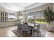 Dining area with table, chairs, and views of the backyard at 20795 W San Juan Ave, Buckeye, AZ 85396