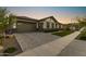Beautiful home with a spacious three car garage and attractive brick driveway at 20795 W San Juan Ave, Buckeye, AZ 85396