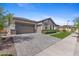 Nice looking three car garage and beautiful rock accents on the front exterior of the home at 20795 W San Juan Ave, Buckeye, AZ 85396