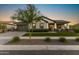 Charming single-Gathering home boasting a well-manicured lawn and a welcoming front porch perfect for relaxing at 20795 W San Juan Ave, Buckeye, AZ 85396