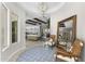 Elegant foyer with a round ceiling, hardwood floors, stylish cowhide chairs, and a large mirror at 20795 W San Juan Ave, Buckeye, AZ 85396