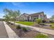 Charming single-story home with manicured lawn, desert landscaping, and inviting curb appeal at 20795 W San Juan Ave, Buckeye, AZ 85396