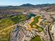 Aerial view of golf course with green fairways, desert landscape, and upscale homes at 20795 W San Juan Ave, Buckeye, AZ 85396