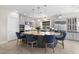 Kitchen with a large center island and pendant lighting, stainless steel appliances, and white cabinets at 20795 W San Juan Ave, Buckeye, AZ 85396