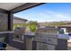 Outdoor kitchen featuring stainless steel Coyote grills, offering stunning mountain views at 20795 W San Juan Ave, Buckeye, AZ 85396