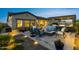 Inviting outdoor patio featuring a cozy fire pit and comfortable seating arrangement for relaxing evenings at 20795 W San Juan Ave, Buckeye, AZ 85396